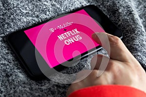 IPhone 11 with T mobile and Netflix Onus logo