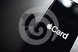 iPhone X with Apple Card logo on the screen.