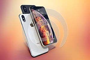 IPhone Xs Gold, Silver and Space Grey on light colors