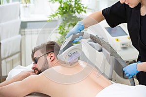 IPL therapy at men`s back photo