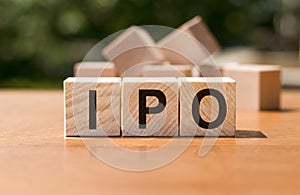 IPO - acronym from wooden blocks with letters, Initial Public Offering IPO concept