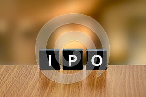 IPO or Initial public offering on black block photo