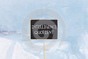 IQ intelligence quotient symbol. Concept words IQ intelligence quotient on beautiful yellow blackboard. Beautiful blue ice photo