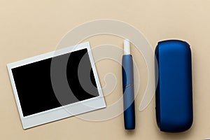 Iqos electronic blue cigarette on a beige background