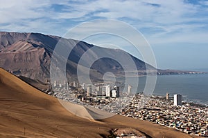 Iquique behind a huge dune, northern Chile