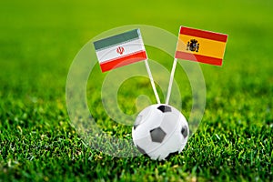 IR Iran - Spain, Group B, Wednesday, 20. June, Football, World Cup, Russia 2018, National Flags on green grass, white football bal