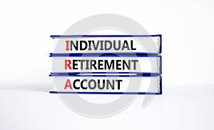 IRA individual retirement account symbol. Concept words IRA individual retirement account on books on beautiful white background.