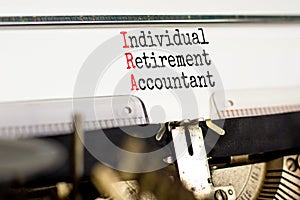 IRA individual retirement account symbol. Concept words IRA individual retirement account typed on retro typewriter. White
