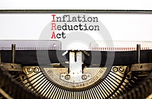 IRA inflation reduction act symbol. Concept words IRA inflation reduction act typed on old retro typewriter. Beautiful white photo