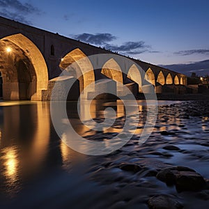 iran ancient bridge over river at blue hour night