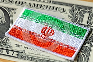 Iran flag on the background of the US dollar, financial concept