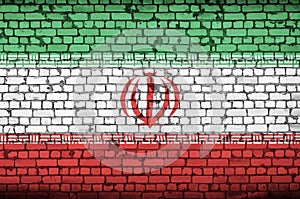 Iran flag is painted onto an old brick wall