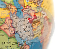 Iran map. Earth globe close up with a red pin.