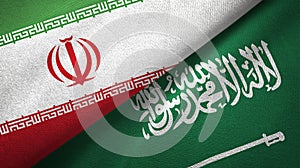 Iran and Saudi Arabia flags textile cloth photo