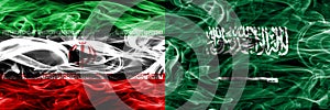 Iran vs Saudi Arabia smoke flags placed side by side. Thick colored silky smoke flags of iranian and Saudi Arabia.