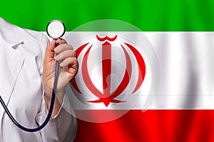 Irani doctor\'s hand with stethoscope on the background of flag of Iran Medicine, clinic, practitioner, healthcare photo