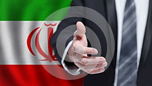 Iranian business, politics, cooperation and travel concept. Hand on flag of Iran background