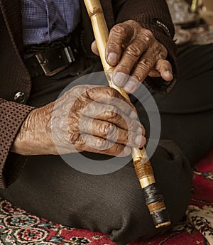 Iranian Hill Tribe Man Plays His Flute