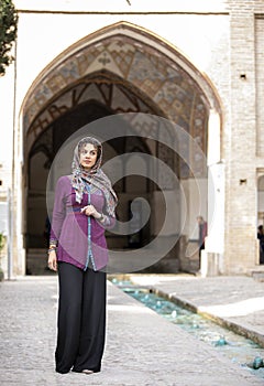 Iranian lady in Fin gardens in Kashan, Iran