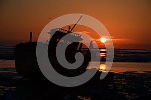 A launch boat in sunset of Persian Gulf photo