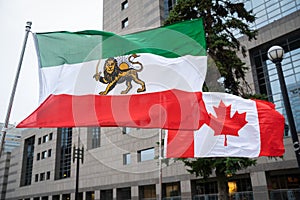 Iranian Shir o Khorshid and Canada Flags Fly Side-By-Side