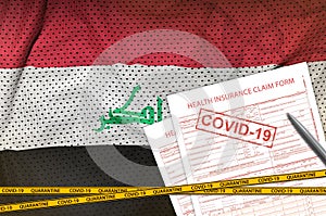Iraq flag and Health insurance claim form with covid-19 stamp. Coronavirus or 2019-nCov virus concept