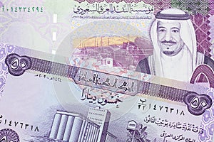 Iraqi currency with a five Saudi riyal note photo