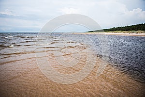 The Irbe River flows into the Baltic Sea photo
