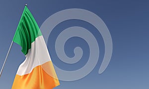 Ireland flag on flagpole on blue background. Place for text. The flag is unfurling in wind. Irish, Dublin. Europe. 3D illustration