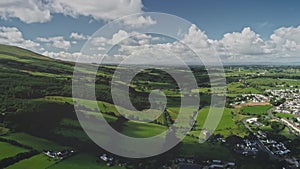 Ireland green farmlands timelapse aerial view. Greenery meadows, fields, pasture Ballycastle