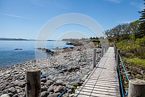 Ireland Landscape with Wooden Pathway on Rocky Beach