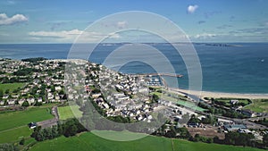 Ireland ocean bay town aerial view: port Ballycastle, Northern. Houses with cottages and city road