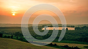 Ireland sunset green landscape tree forest rural area hill field meadow