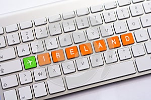 IRELAND writing on white keyboard with a aircraft sketch