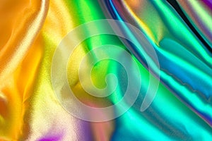 Iridescent fabric background. Shiny mother of pearl fabric, bright multi-colored fabric