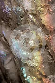Iridescent natural transparent glossy and magic geometric Calcite crystal stucture on sun light. Texture of gemstone