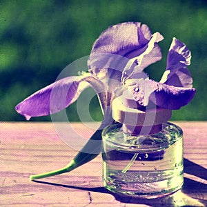 Iris and bottle of parfum