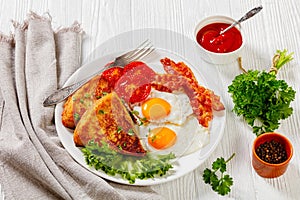 Irish breakfast of fried eggs, bacon, potato farls