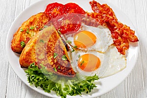 Irish breakfast of fried eggs, bacon, potato farls