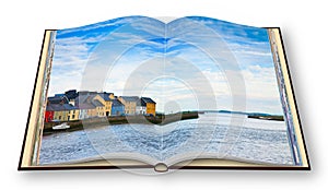 Irish coastal landscape with the typical colored fishermen`s houses with sloping roofs Galway - Ireland