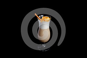 Irish coffee in glass on black background