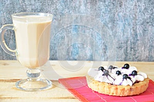 Tiramisu cake and irish coffee on a white plate. White background.