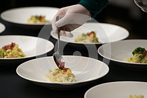 Irish colcannon served in a white bowl or traditional mashed potato with addition of kale, leek and green onion, close-up