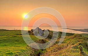 Irish cottage house at sunset photo