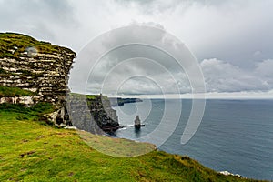 Irish countryside landscape on the Cliffs of Moher and the Branaunmore sea stack