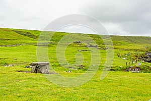 Irish dolmen in the meadow in the coastal walk route from Doolin to the Cliffs of Moher
