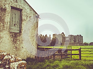 Irish farmhouse and castle with sun