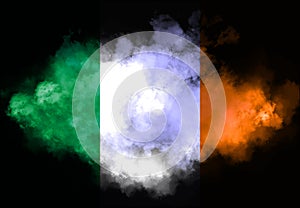 Irish flag performed from color smoke on the black background. Abstract symbol