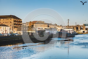 Irish History and industrial cityscape: The iconic, rusty MV Hebble Sand mooring alongside the quay