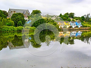Irish landscape with colorful houses reflected in the water, Ireland